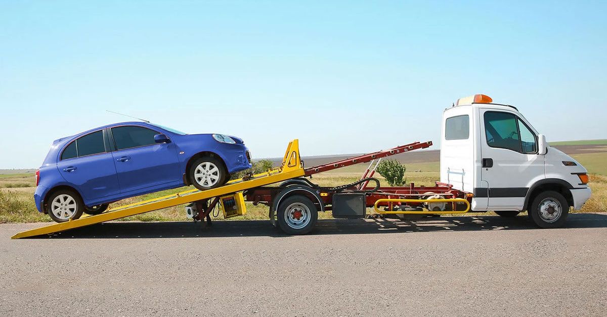 Tow truck loading a passenger vehicle
