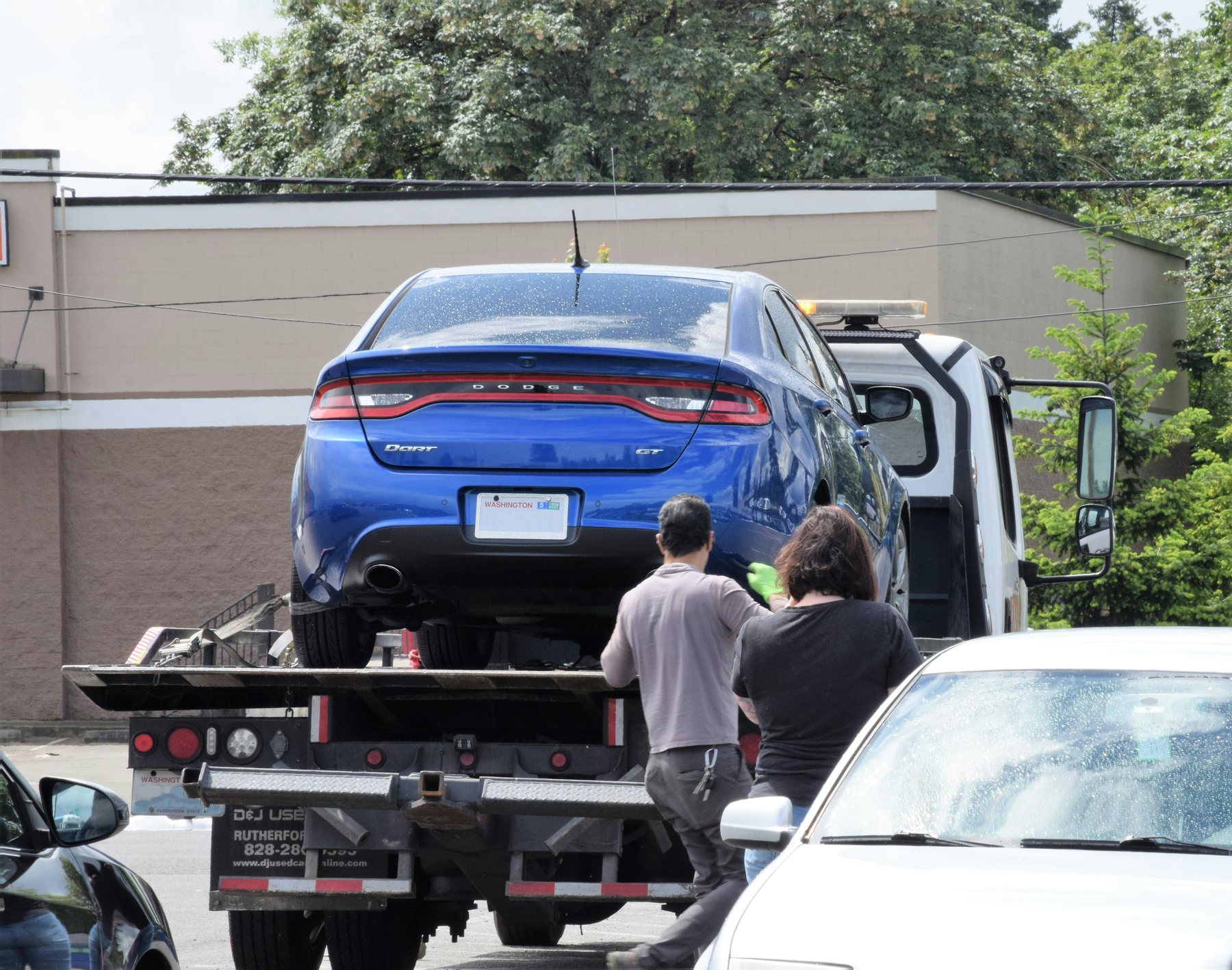Tow operator preparing a flatbed at the roadside
